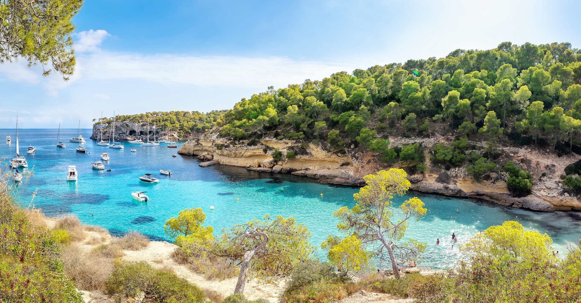 Yacht anchored in a Mediterranean cove